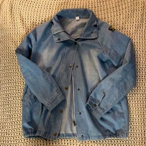 Size Large Denim Jacket with Unique Details.